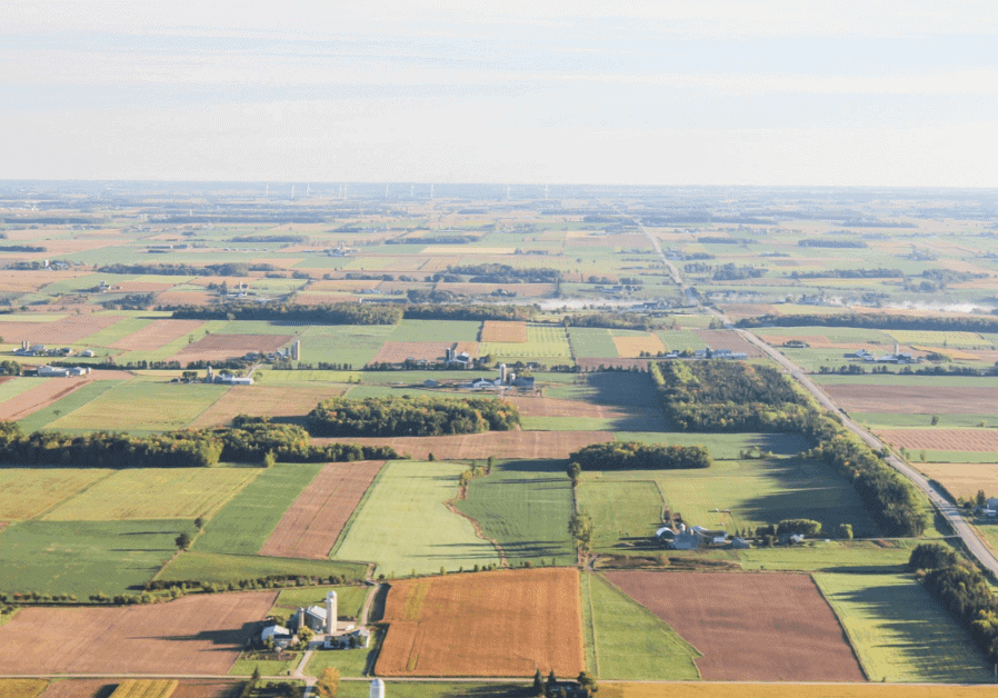 An aerial view of farmland and fields.
