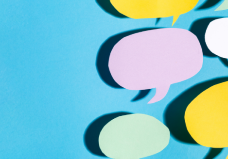 Paper speech bubbles on a blue background.